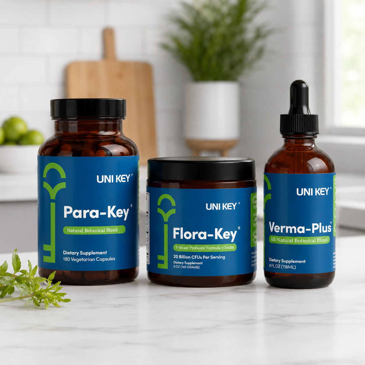 30-Day Parasite Cleanse Kit — Para-Key®, Verma-Plus®, and Flora-Key® UNI KEY 30-Day Parasite Cleanse Kit — Para-Key capsules, Verma-Plus tincture, and Flora-Key probiotic powder arranged on a travertine stone surface with linen and olive branch.